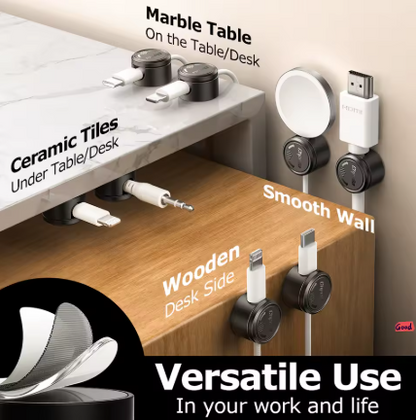 A set of magnetic cable organizers shown mounted on a marble countertop, wooden desk, and smooth wall, with labeled examples including Marble Table, Ceramic Tiles, Under Table, Wooden Desk Side, and Smooth Wall. The image includes a close-up of the organizer interior and the text 'Versatile Use In your work and life.