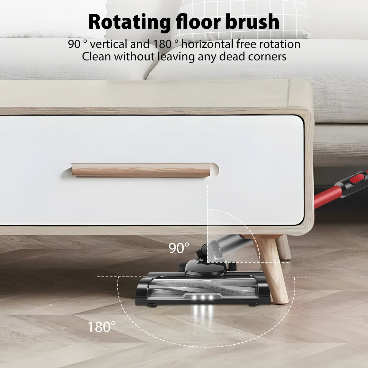 Vacuum cleaner with rotating floor brush cleaning under a piece of furniture.