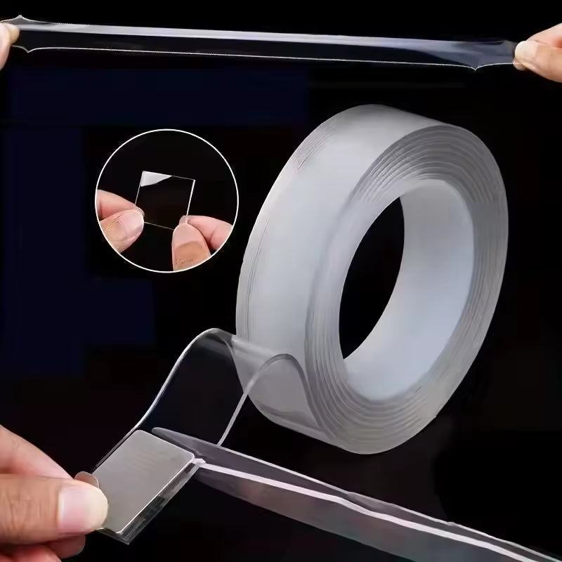 Roll of clear tape with a person peeling off a strip, on a black background.