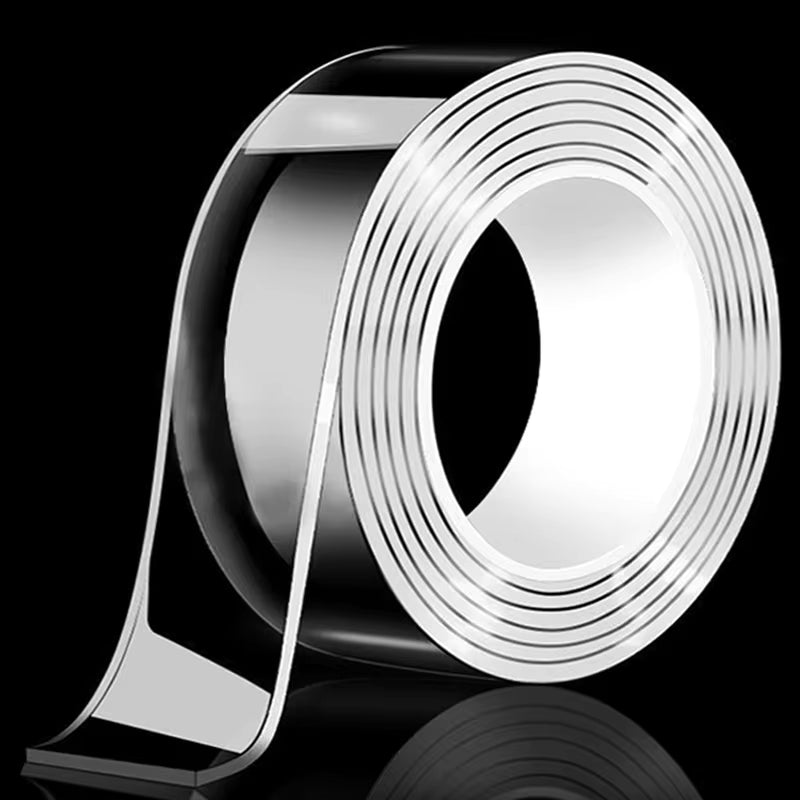 Roll of silver adhesive strip on a black background