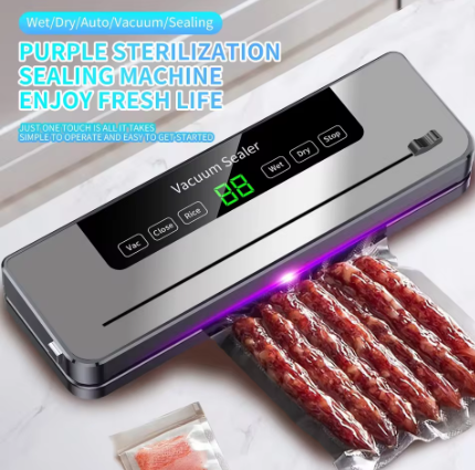 A countertop vacuum sealer machine with a digital display and control buttons, shown sealing a clear plastic bag containing sliced sausage. The product is metallic silver with a black control panel, and purple light is emitted from the sealing area.