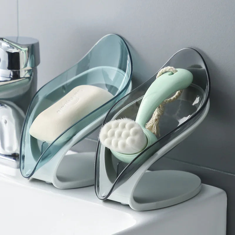 Bathroom setup with a soap dish, scrubber, and soap on a gray wall.