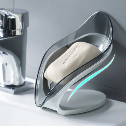 Soap dish with a bar of soap on a bathroom counter