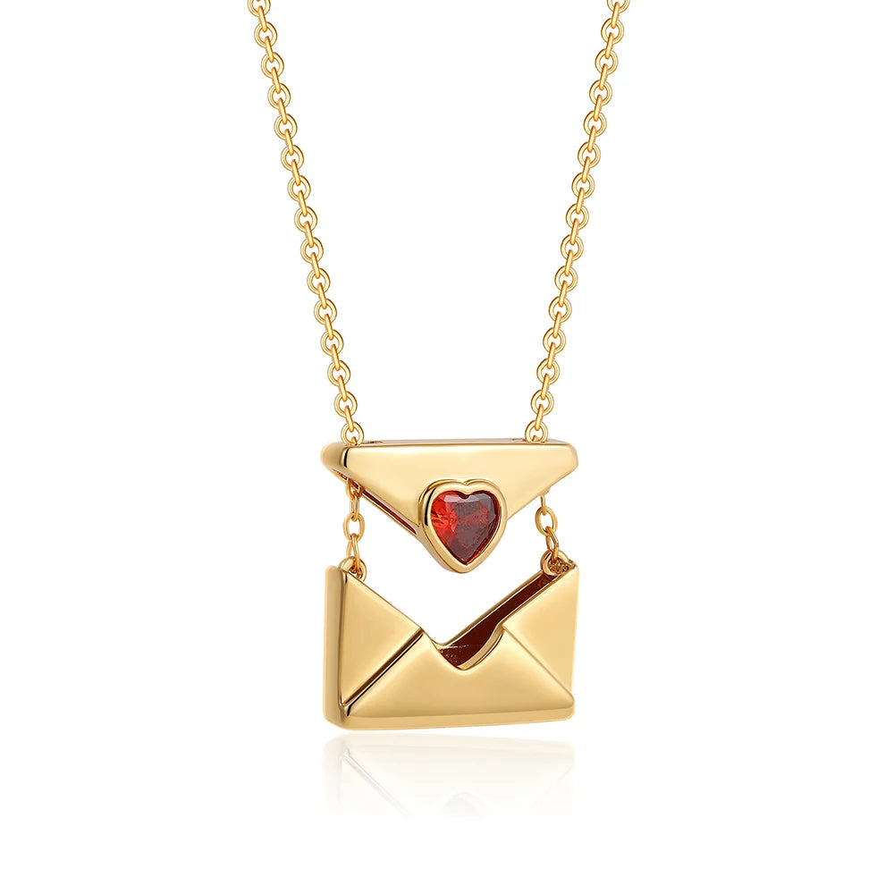 Gold necklace with a heart-shaped pendant on a white background