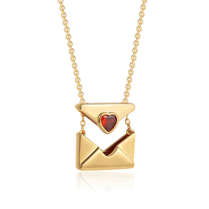Gold necklace with a heart-shaped pendant on a white background