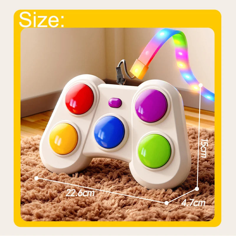 A colorful toy game controller with a flexible rainbow LED strip attached, shown on a brown rug with overlaid dimensions reading 22.6cm, 15cm, and 4.