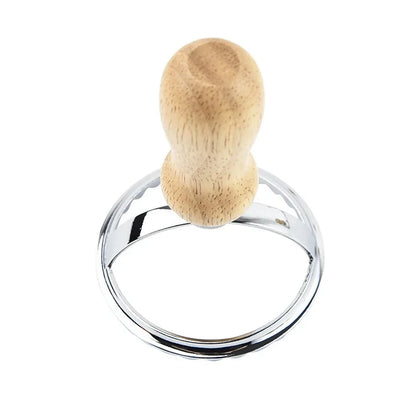 Wooden object with a metallic ring on a white background