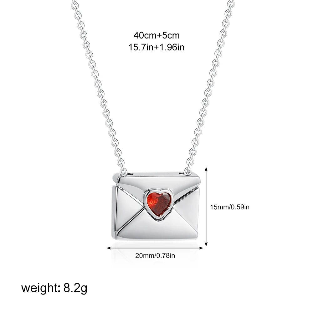 Silver necklace with a heart-shaped gemstone pendant, shown with measurements on a white background.