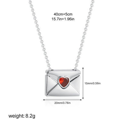 Silver necklace with a heart-shaped gemstone pendant, shown with measurements on a white background.