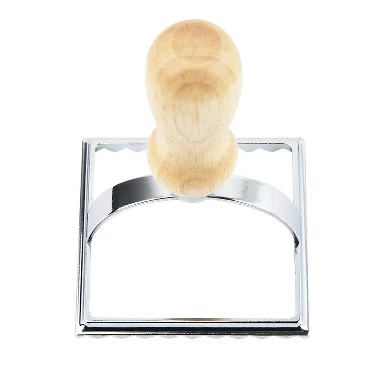 Metallic stamp with wooden handle on a white background