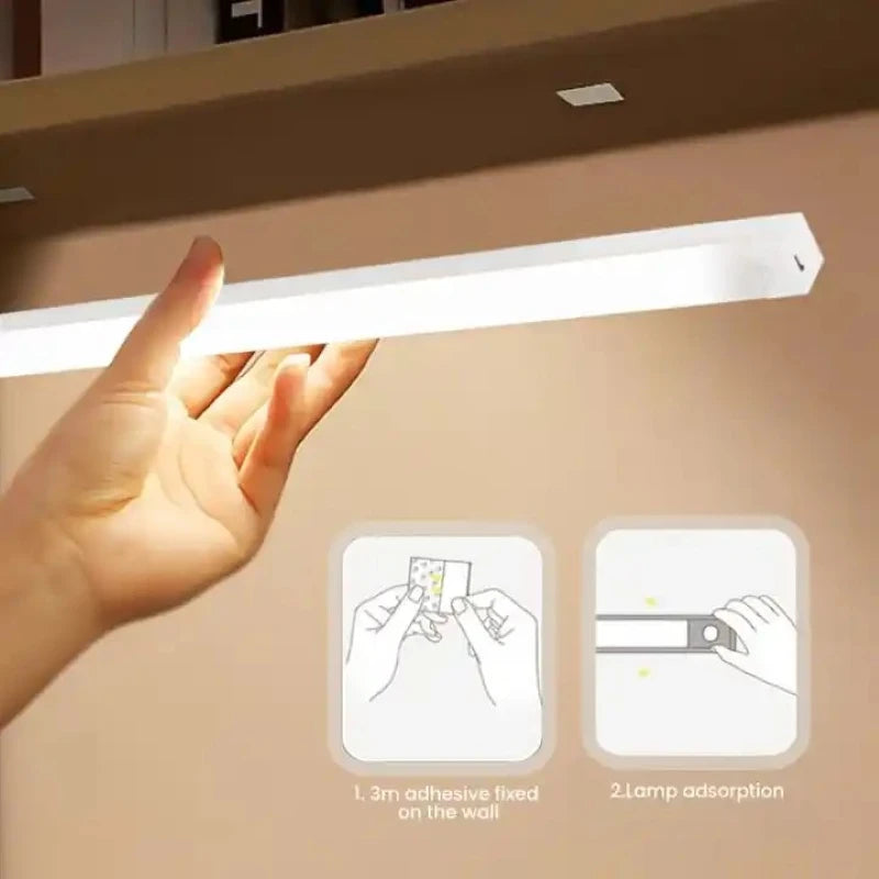 Hand holding a rectangular light fixture with adhesive application instructions on a beige background