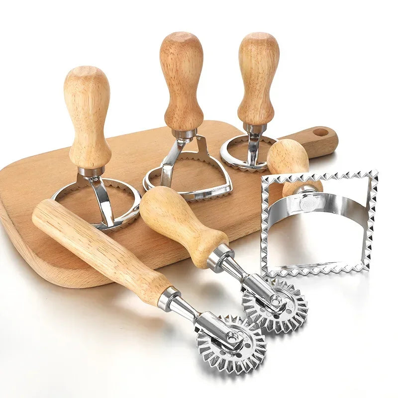 Set of dough cutters with wooden handles on a white background