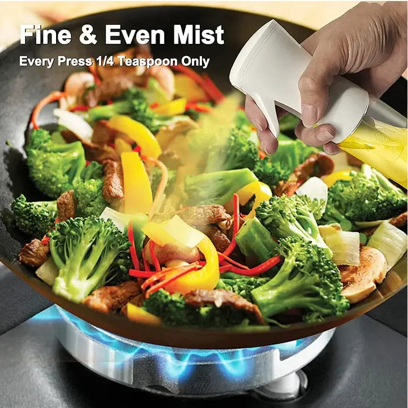 Sprayer over a pan of vegetables cooking on a stove with text about mist control.