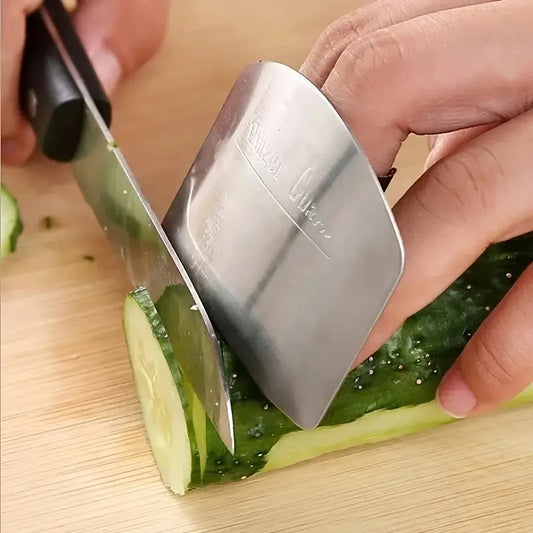 Person using a mandoline slicer to cut cucumbers on a wooden board