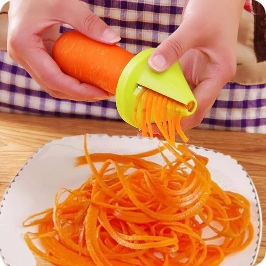 Person using a carrot spiralizer to create thin carrot strands on a white plate.
