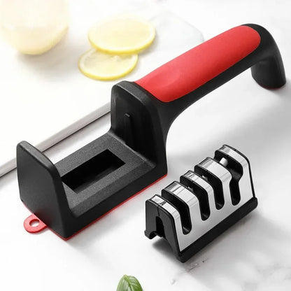 Knife sharpener with red handle on a white surface