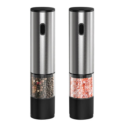 Two electric pepper mills with black bases and silver bodies on a white background.