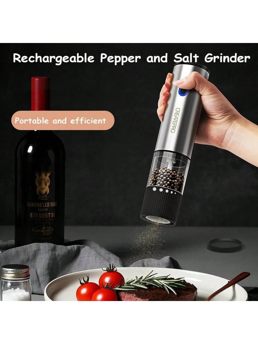Rechargeable pepper and salt grinder being used over a dish with tomatoes and herbs, with a bottle in the background.