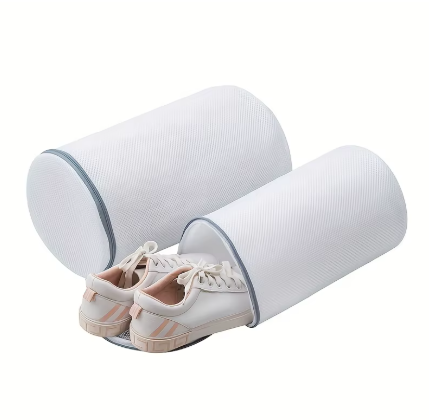 Two white cylindrical shoe dryers with gray trim, shown with a pair of white sneakers inside on a clean white background.