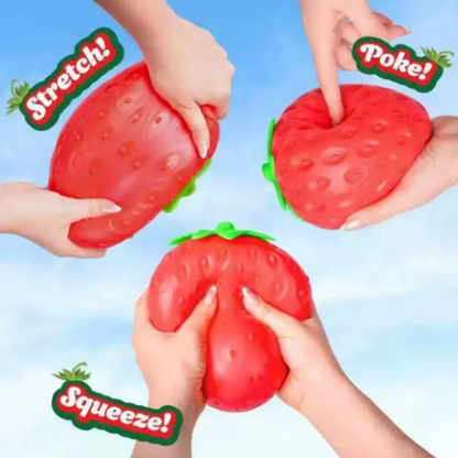 Three hands demonstrate squishy strawberry-shaped stress toys against a light blue sky background, with text overlays reading 'Stretch!', 'Poke!', and 'Squeeze!'.