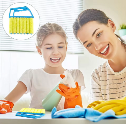 A woman and a young girl are smiling while cleaning at a table, with cleaning supplies including a yellow sponge brush, blue cloth, and orange gloves. An inset circle in the top-left shows the yellow sponge brush with a blue handle.