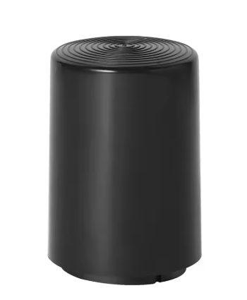 A black cylindrical device with a ribbed circular top surface, shown against a plain white background.